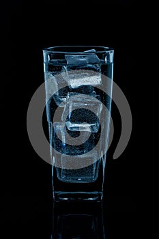 Silhouette of a glass with water on a black background