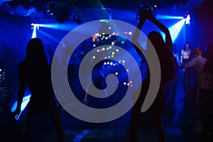 silhouette of go-go dancer girl on stage in nightclub