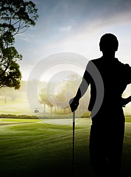 Silhouette of golfer