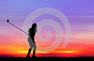 Silhouette golfer playing golf at beautiful sunset