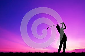 Silhouette golfer playing golf at beautiful sunset