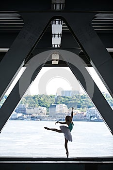 Silhouette of graceful ballerina in white tutu