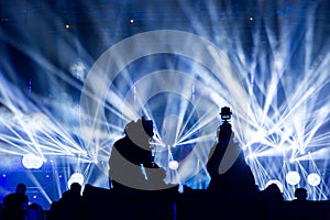 Silhouette of a group of cameramen broadcasting an event.