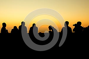 silhouette of group of friends standing