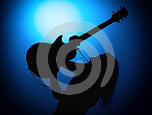 Silhouette guitarists of a rock band with guitar on blue background
