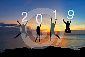 Silhouette happy business teamwork jumping congratulation graduation in Happy New year 2019. Freedom lifestyle group people jump a