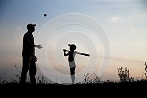 silhouette Happy child with parent playing baseball concept