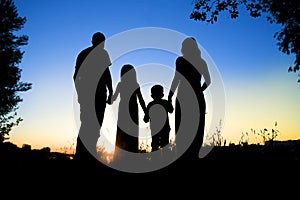 Silhouette of a happy family with children