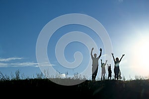 Silhouette of a happy family with children