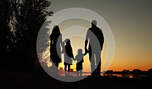 Silhouette of a happy family with children