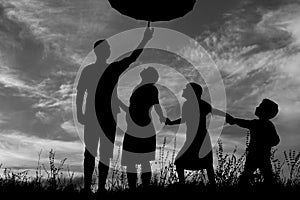 Silhouette of a happy family with children