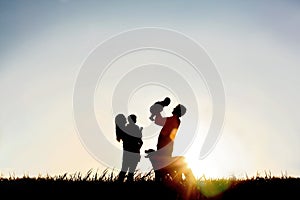 Silhouette of Happy Family and Dog