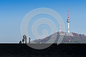 A silhouette of a happy family with Seoul Tower background,korea