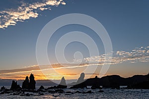 Silhouette of Hashigui-iwa Rocks at dawn photo