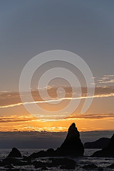 Silhouette of Hashigui-iwa Rocks at dawn photo
