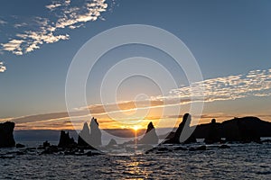 Silhouette of Hashigui-iwa Rocks at dawn photo
