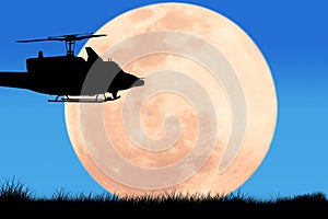 Silhouette of helicopter on the sky night full moon