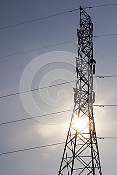 Silhouette of high voltage pylons.