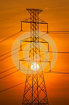 Silhouette of High voltage tower.