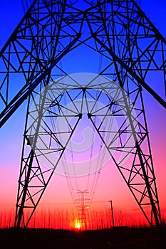 The silhouette of high voltage towers