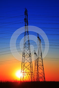 The silhouette of high voltage towers