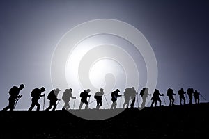 Silhouette of hikers on hill