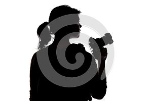 Silhouette of a Hiking Photographer on a White Background