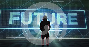 Silhouette of hooded hacker standing in front of a digital screen wall with various code, words and virus symbols. Camera approach