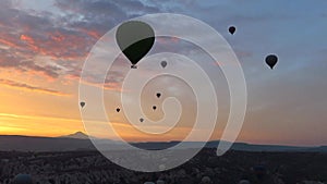 Silhouette of Hot Air Balloons Flying Over Cappadocia at Sunrise