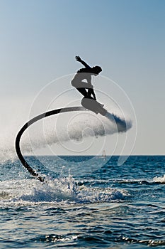 Silhouette of a hover board rider