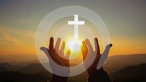 Silhouette of human hands palm up praying and worship of cross, eucharist therapy bless god helping, belief, forgiveness, freedom