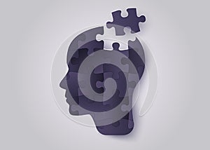 Silhouette of a human head with jigsaw puzzle. Concept of mental health and psychology