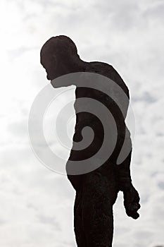 Silhouette of a human statue of stone