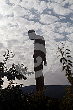 Silhouette of a human statue of stone