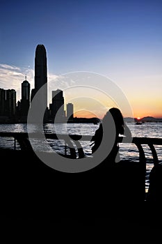 Silhouette of IFC skyscraper as seen from Wan Chai temporary promenade, Hong Kong