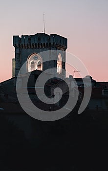 A lighted tower seen in the dark of night