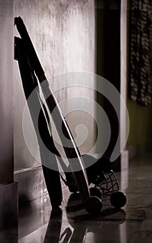 Silhouette image of cricket instruments like bat, ball, helmet placed at store room.
