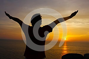 Silhouette Image of Man Raising His Hands