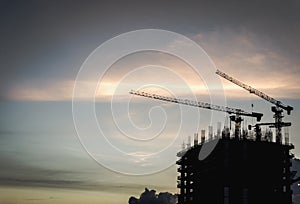 Silhouette of industrial cranes