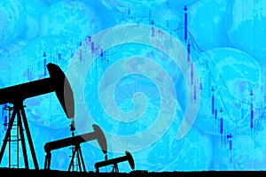 Silhouette industrial oil pump jack and falling oil graph on the blue globe background