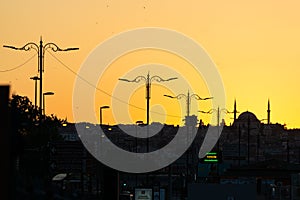 Istanbul Silhouette at Sunset With Iconic Mosque photo
