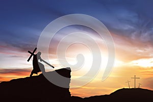 Silhouette of Jesus carry his cross