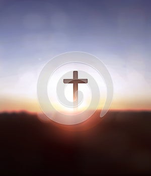 Silhouette jesus christ cross on sunrise background