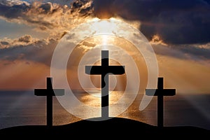 Silhouette of Jesus Christ crucifixion on cross, Good Friday Easter over heaven -Three Crosses On Hill landscape horizontal