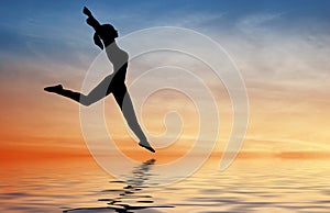 Silhouette jump girl on water