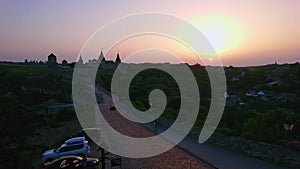 Silhouette of Kamianets-Podilskyi Castle against the sunset sky, Ukraine