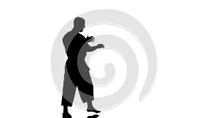 Silhouette of a karate man exercising against