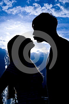 Silhouette of kissing people