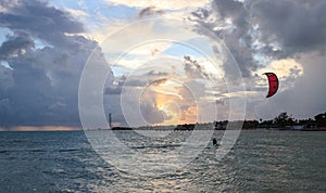 Silhouette of a Kite surfer in the ocean at sunset