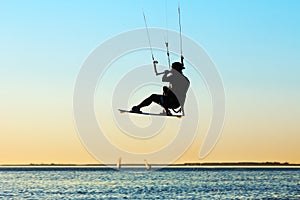 Silhouette of a kitesurfer